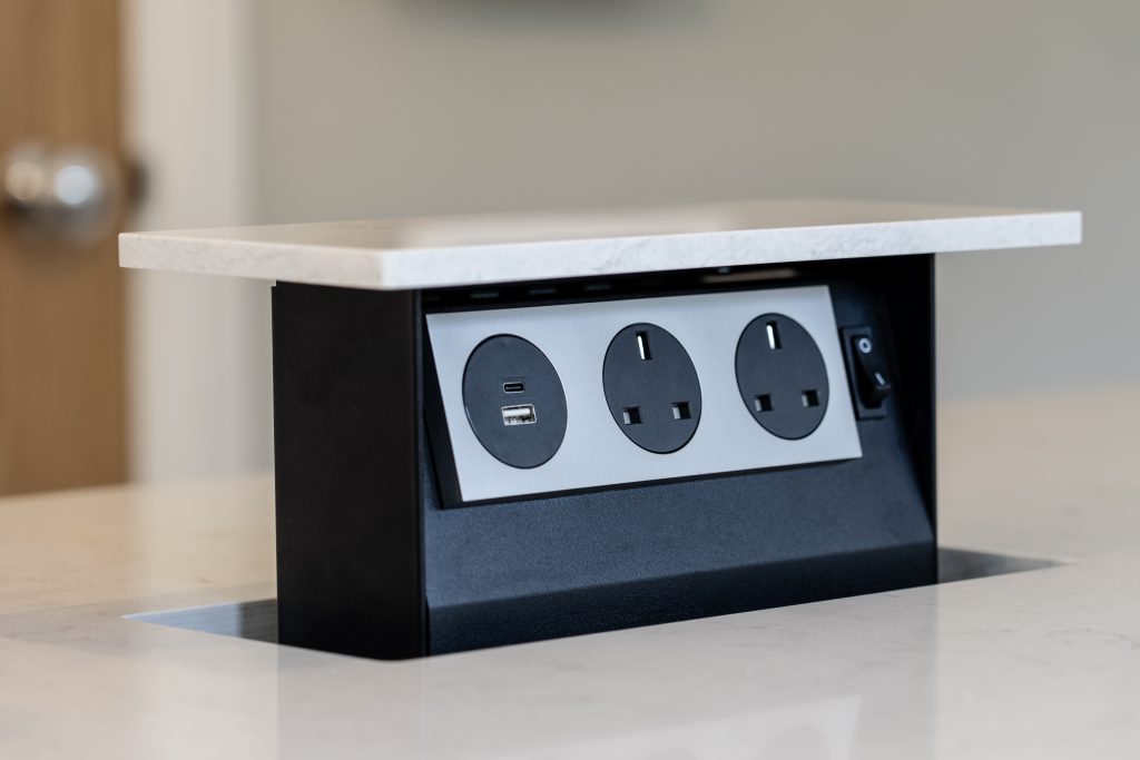 Pop-up worktop power point with USB connections in the completed Purley kitchen