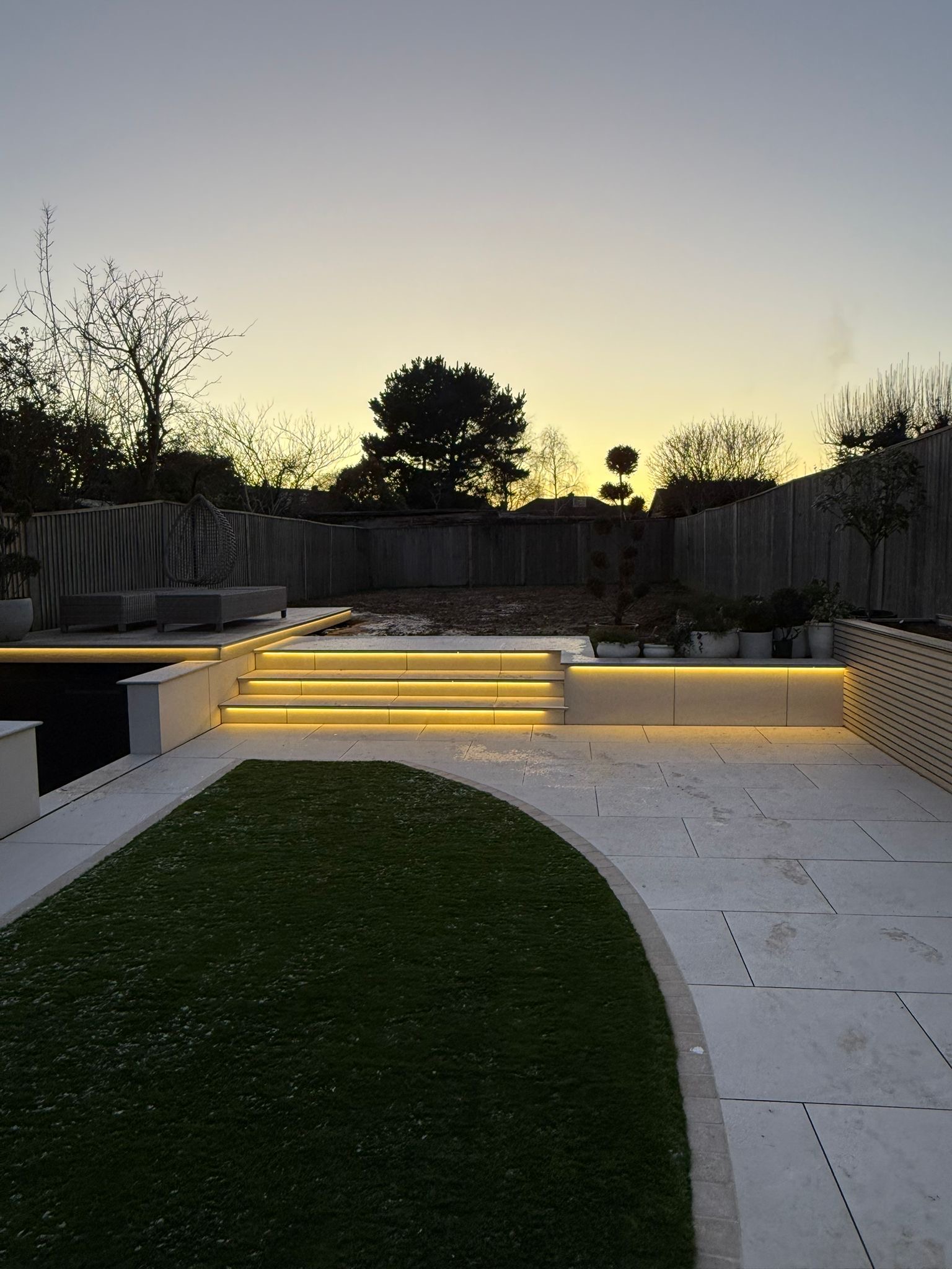 Wide dusk view of the finished Smart Pond automated lighting scheme in Reading