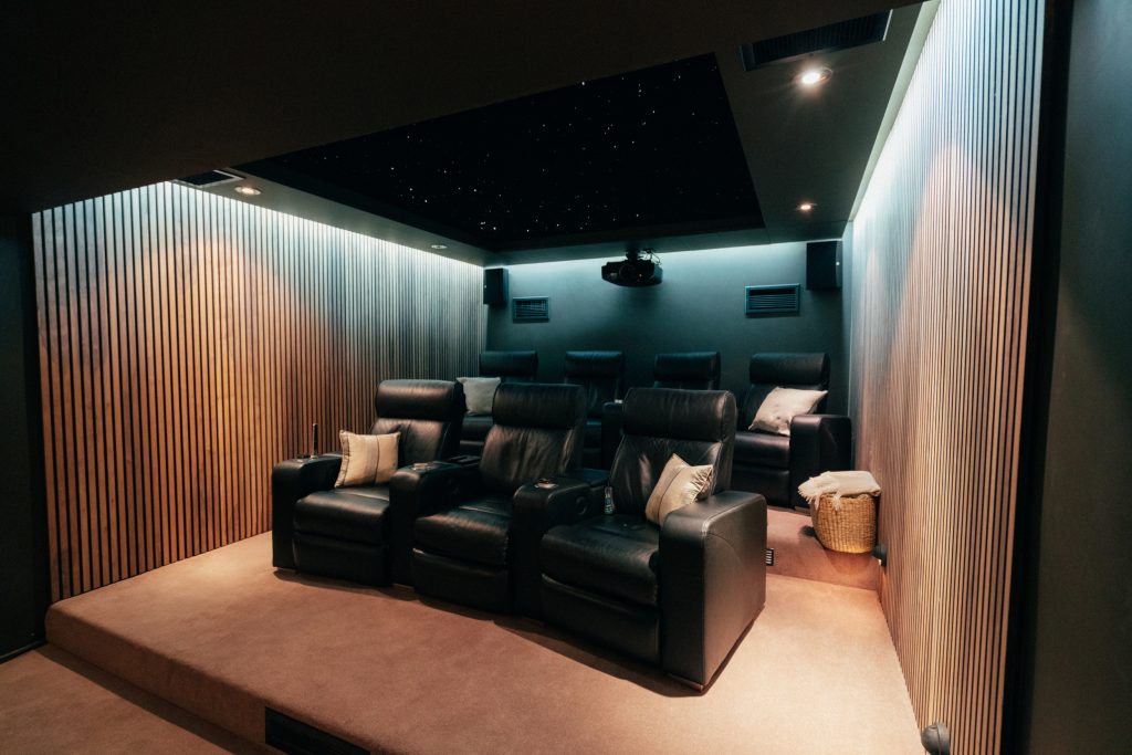 TV and cinema room with integrated ceiling and wall lighting